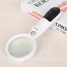 Lupa De Mão Com Duas Lentes E Dois Leds Ergonômica Estética Foto mini  3